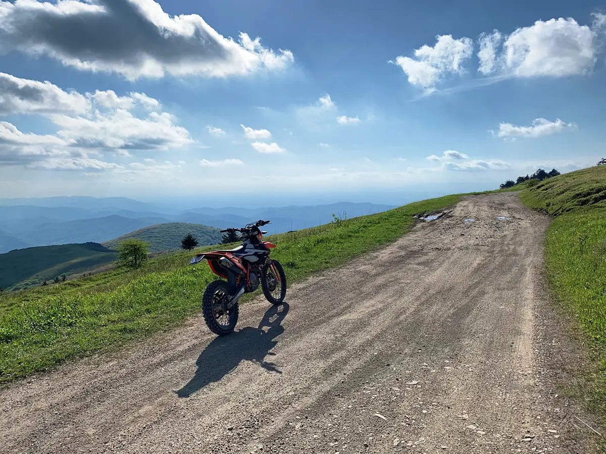 KTM motorcycle with the views of North Carolina Mountains | Unseen Pass UTV Rentals